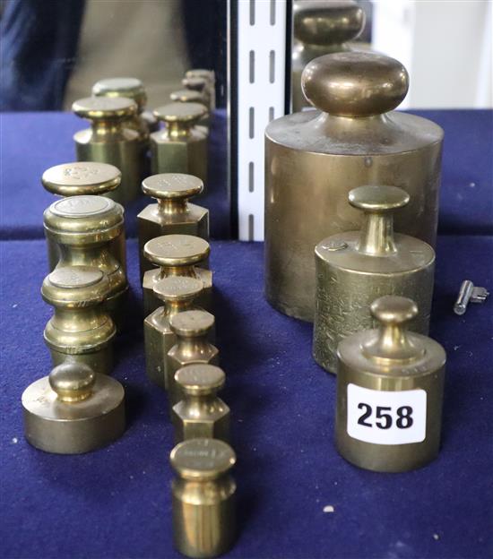 A collection of thirteen brass weights